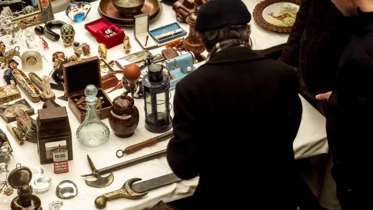 Compare website marketplaces: fees, vetting, minimums and niche specializations Compare website marketplaces: fees, vetting, minimums and niche specializations — Antique Market Stall with Diverse Coll