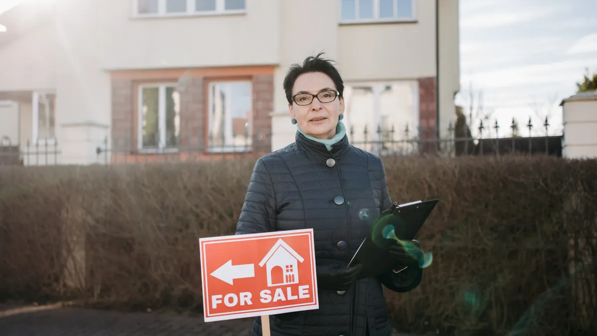 Flippa alternatives: vetted marketplaces and brokers for selling small sites — Realtor in a Winter Coat Standing by a Fo