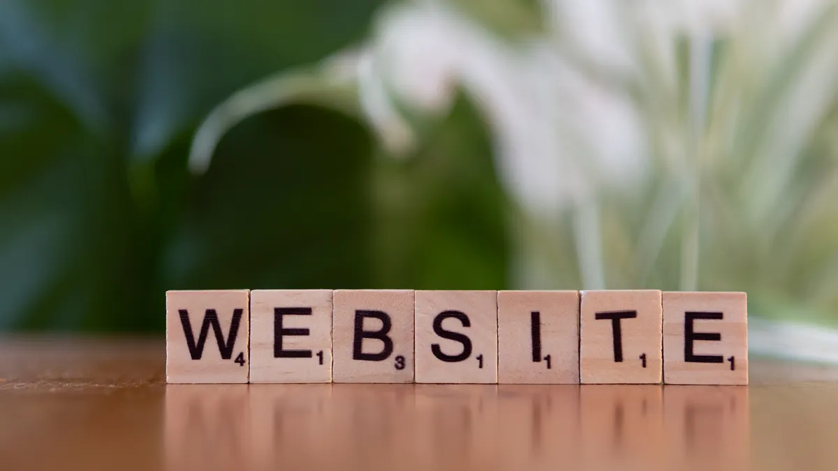 How to value a website: step‑by‑step valuation for content sites, SaaS and e‑commerce — Scrabble Tiles Spelling 'Website