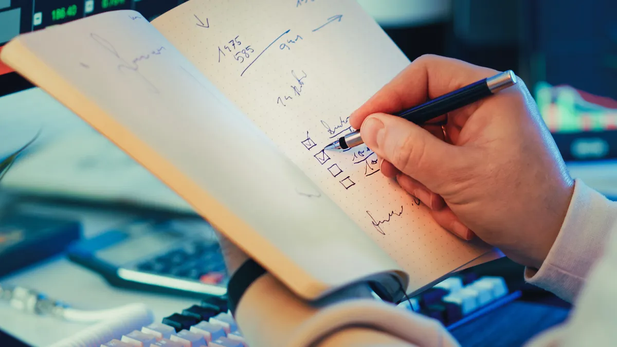 How to write a website listing that converts: title, financial summary and proof points — Person Writing in Notebook for
