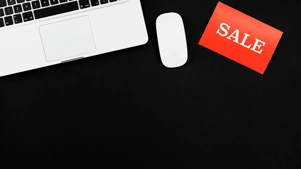 Where to sell a website: marketplace, broker and private-sale options by site size — Macbook Pro Beside Red and White Sa